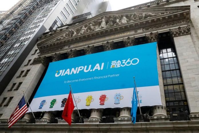 A banner for Jianpu Technology Inc. hangs on the front of the NYSE to celebrate the company's IPO in New York